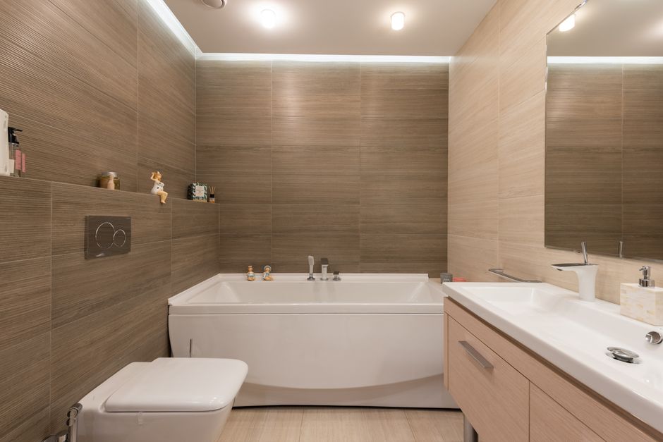 Elegant bathroom featuring modern fixtures and wooden tiles.