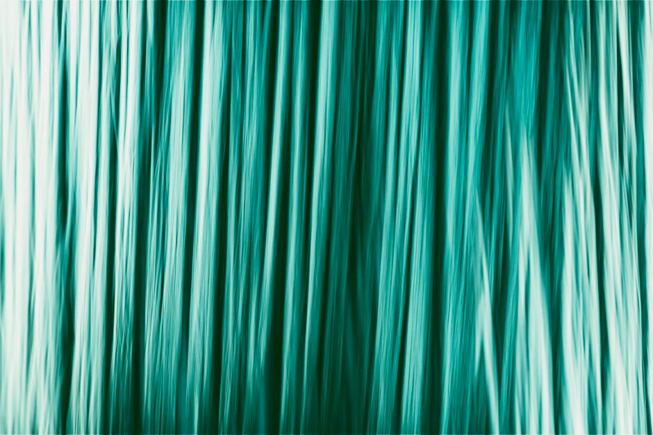 Vivid abstract image featuring ethereal blue lines creating a serene and flowing texture.